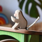 Ostheimer sitting baboon placed on the roof of the Ostheimer hutch for toy animals. 