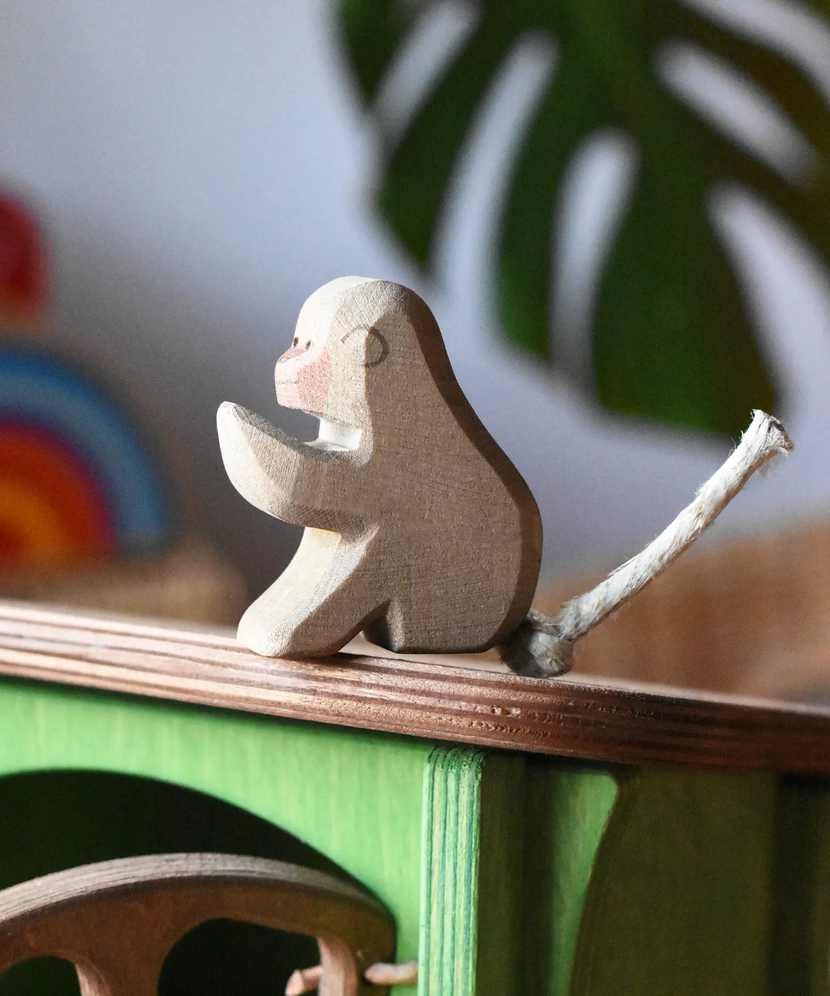 Ostheimer sitting baboon placed on the roof of the Ostheimer hutch for toy animals. 