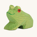 Ostheimer Sitting Frog wooden toy figure on a plain background. 
