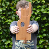 Child holding the Ostheimer small wooden lookout tower wooden toy.