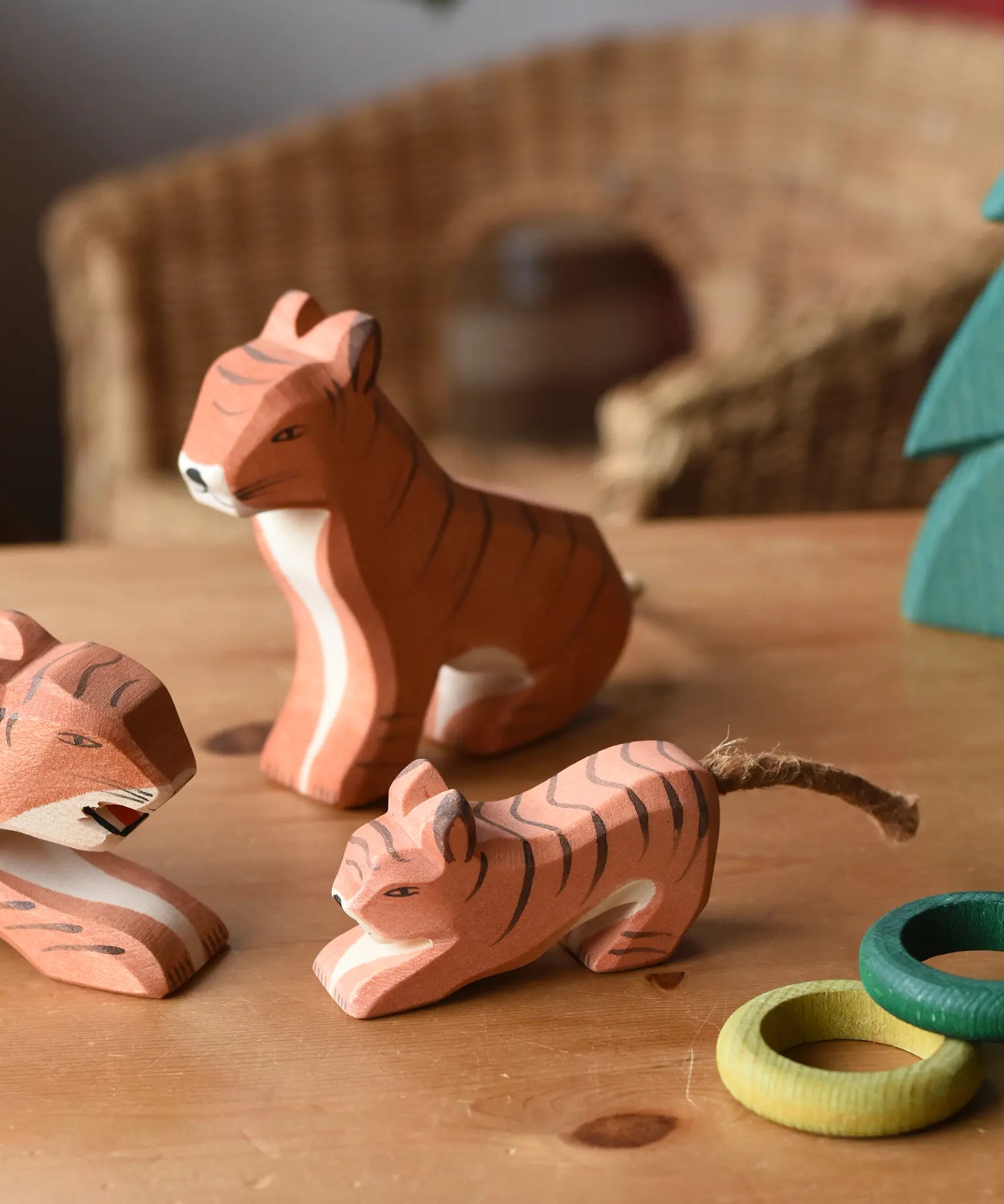 Ostheimer tigers placed on a wooden surface with the small lurking tiger at the front. 