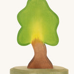 Ostheimer Small Oak Tree & Support wooden toy figures on a plain background. 