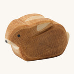 Ostheimer small rabbit wooden oy figure on a plain background. 
