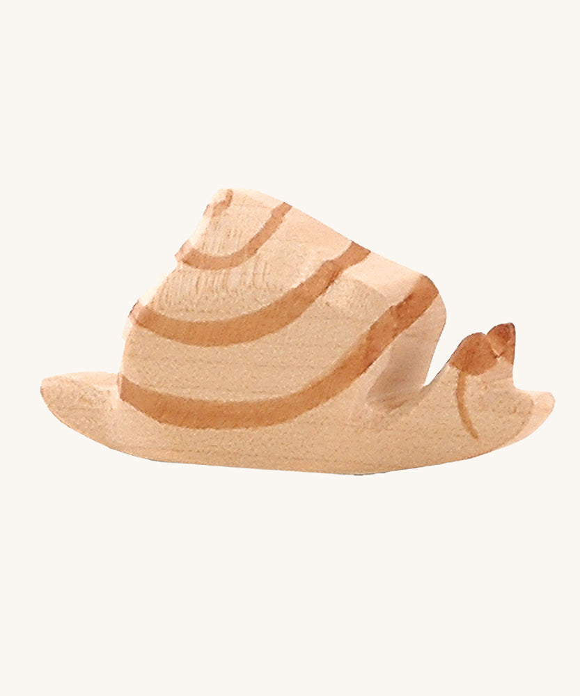 Ostheimer wooden snail figure on a plain background. 