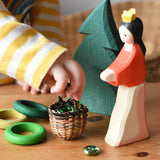 Small Kraul basket filled with Billes flat marbles placed in the middle of a small world play scene with Ostheimer figures and Grapat wooden rings. 