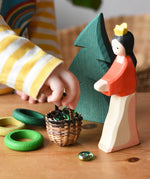 Small Kraul basket filled with Billes flat marbles placed in the middle of a small world play scene with Ostheimer figures and Grapat wooden rings. 