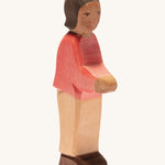 Ostheimer son with brown skin on a plain background. 