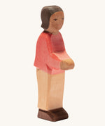 Ostheimer son with brown skin on a plain background. 