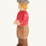 Ostheimer Son wooden figure with white Skin on a plain background. 