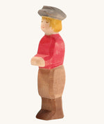 Ostheimer Son wooden figure with white Skin on a plain background. 