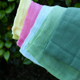 Close up of the Ostheimer Spring decoration scarves play cloths draped over a child's arm.