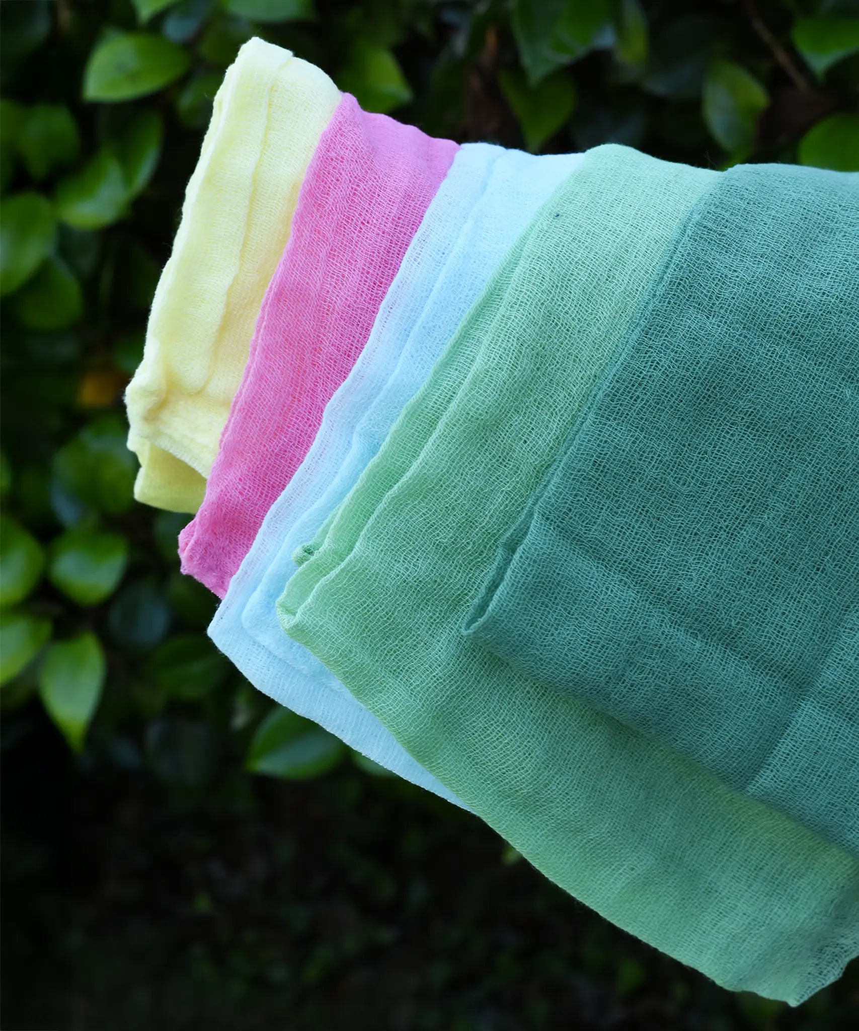 Close up of the Ostheimer Spring decoration scarves play cloths draped over a child's arm.