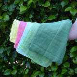 Ostheimer Spring decoration scarves play cloths draped over a child's arm.