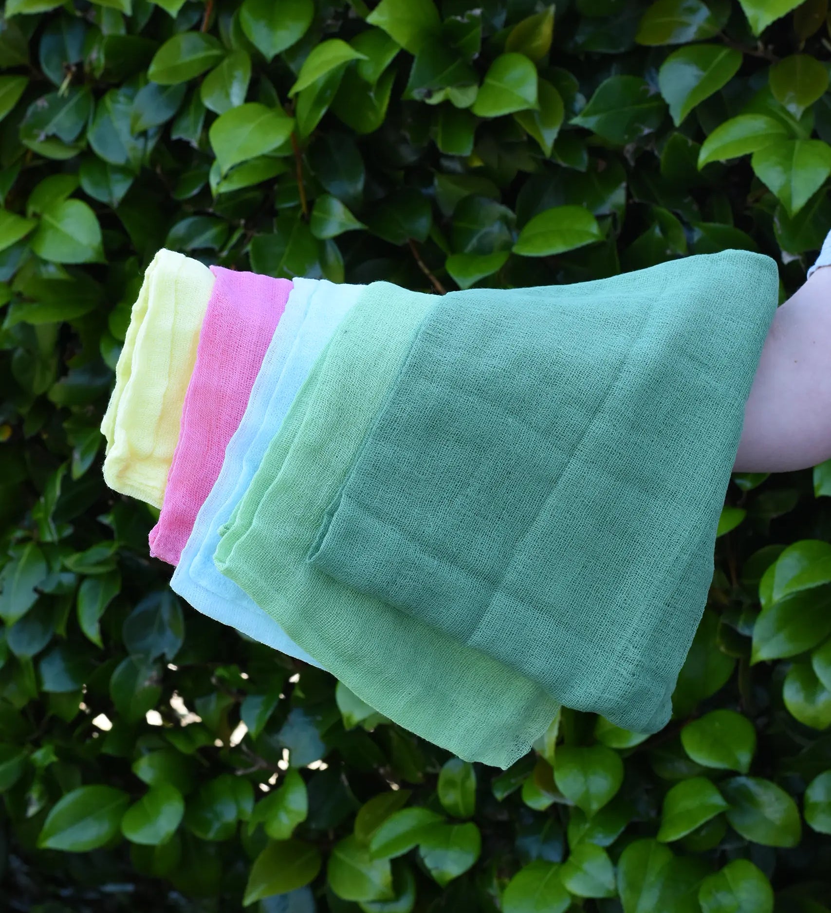 Ostheimer Spring decoration scarves play cloths draped over a child's arm.