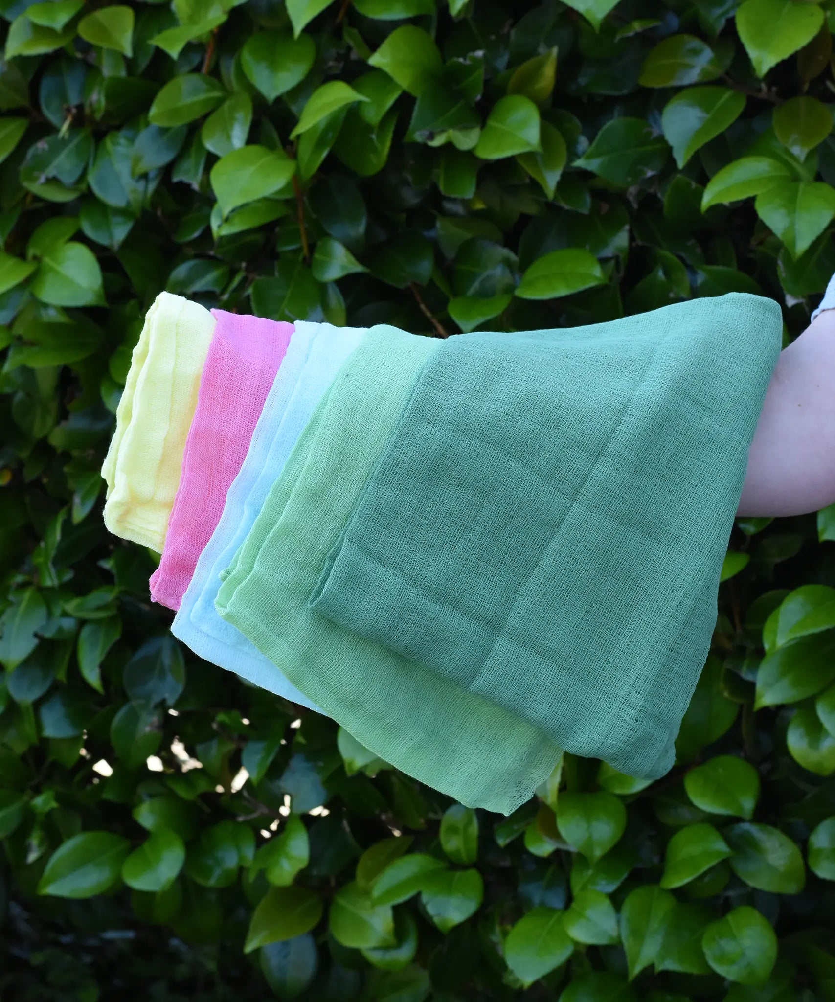 Ostheimer Spring decoration scarves play cloths draped over a child's arm.