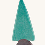 Ostheimer spruce tree wooden toy figures on a plain background. 