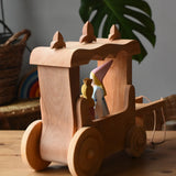 Back of the Ostheimer Wooden Stage Coach toy with princess figures placed inside.