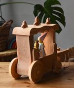Back of the Ostheimer Wooden Stage Coach toy with princess figures placed inside.