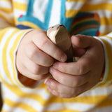 Ostheimer standing sea otter in a child's hands.
