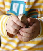Ostheimer standing sea otter in a child's hands.