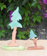 An Ostheimer tall spruce tree pictured next to the fir tree for dwarves. 