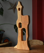 Ostheimer tower with stairs wooden toy building placed on a wooden surface.