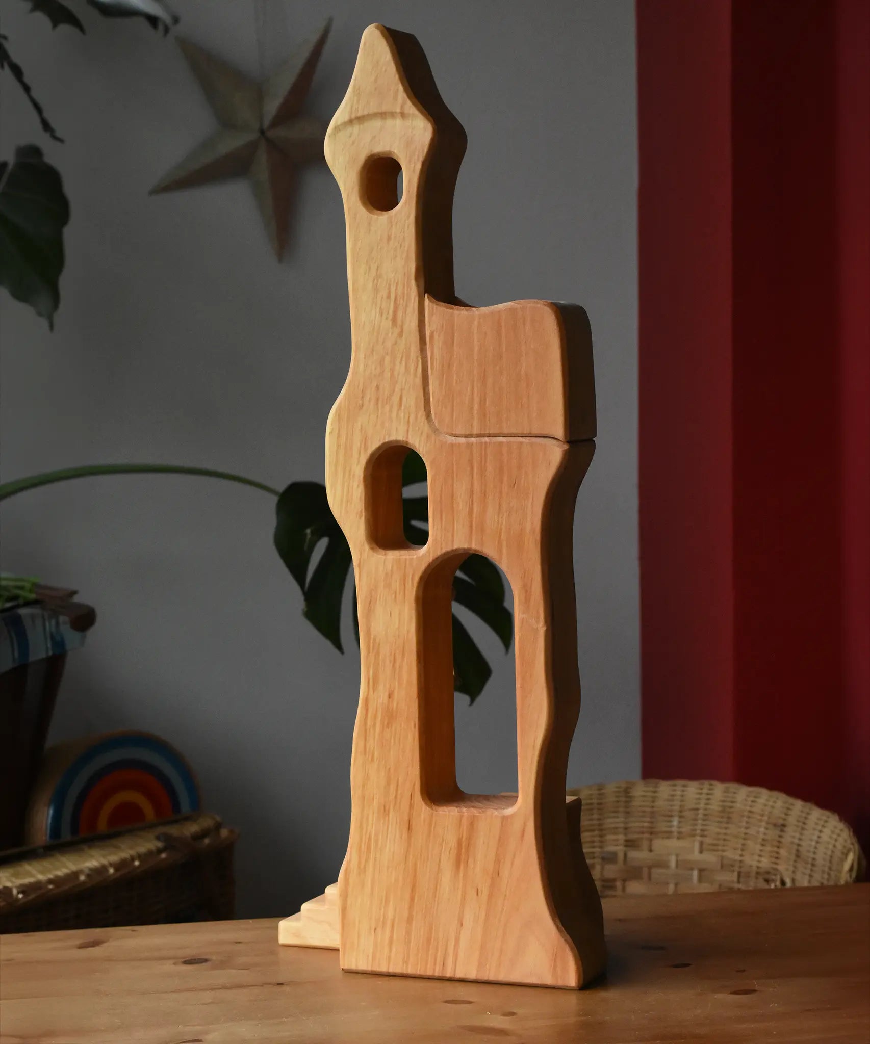 Ostheimer tower with stairs wooden toy building placed on a wooden surface.