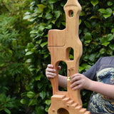 Ostheimer tower with stairs held up in a child's hands.