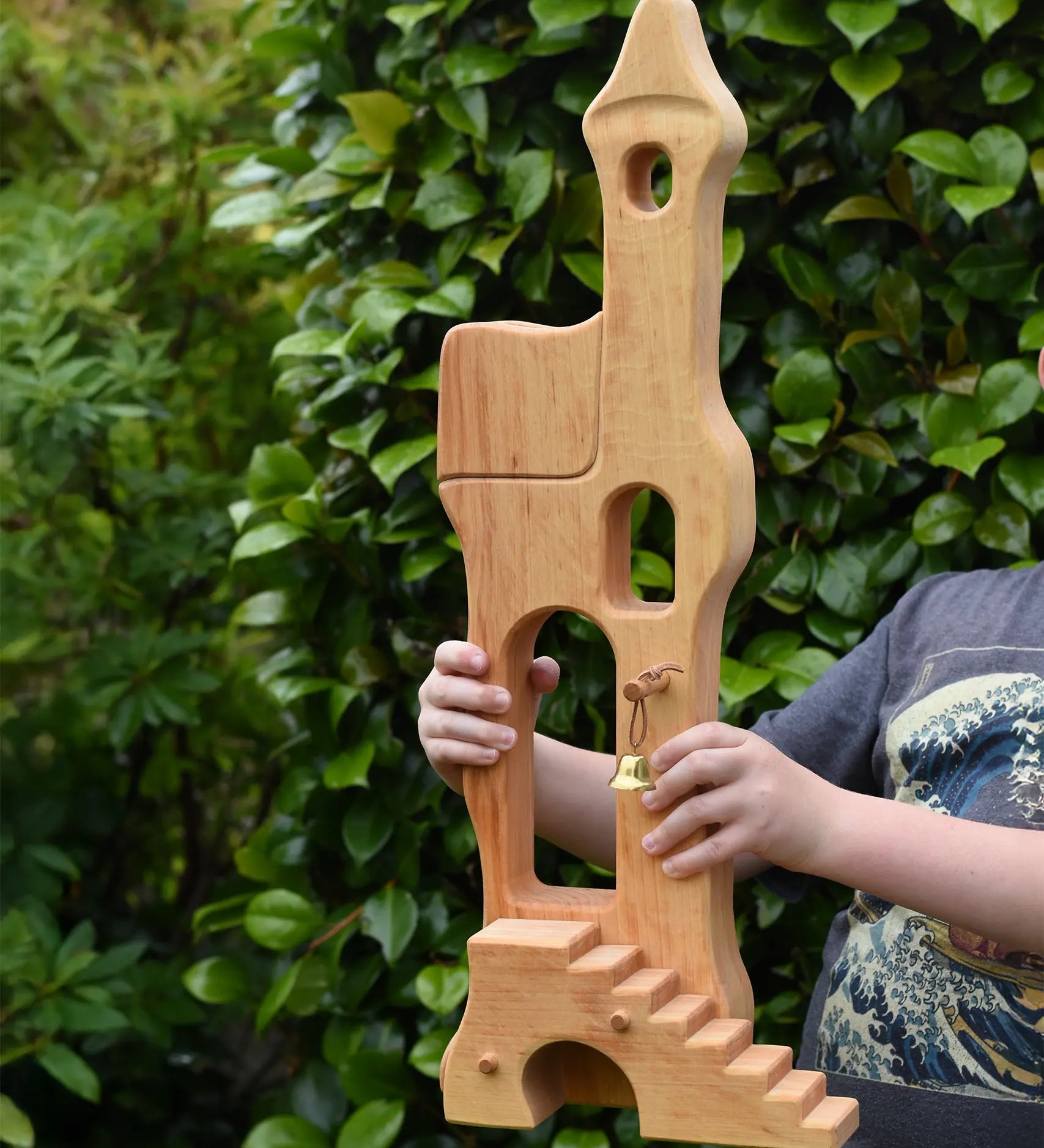 Ostheimer tower with stairs held up in a child's hands.