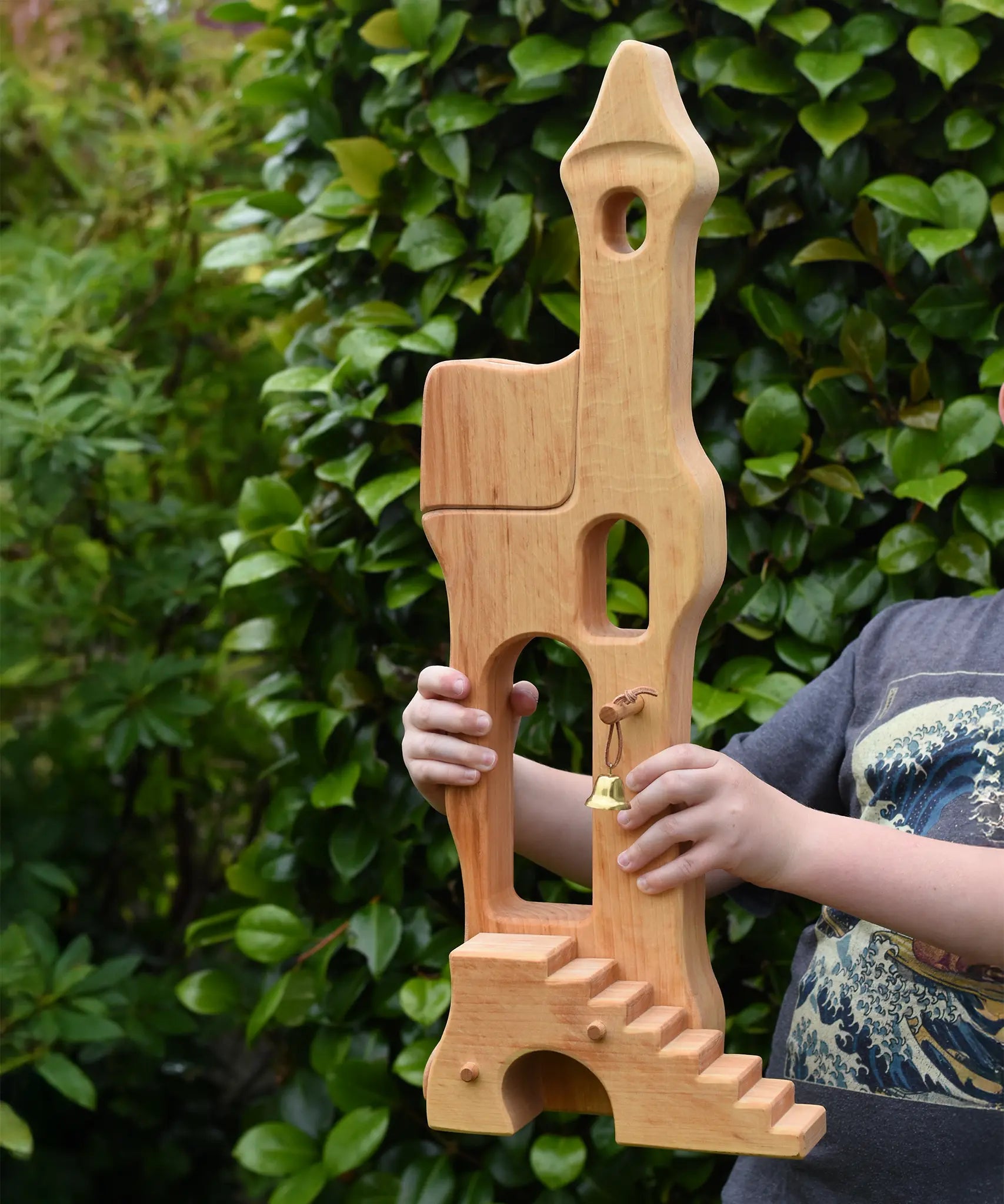 Ostheimer tower with stairs held up in a child's hands.