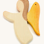 A white wooden angel figure on a cream background
