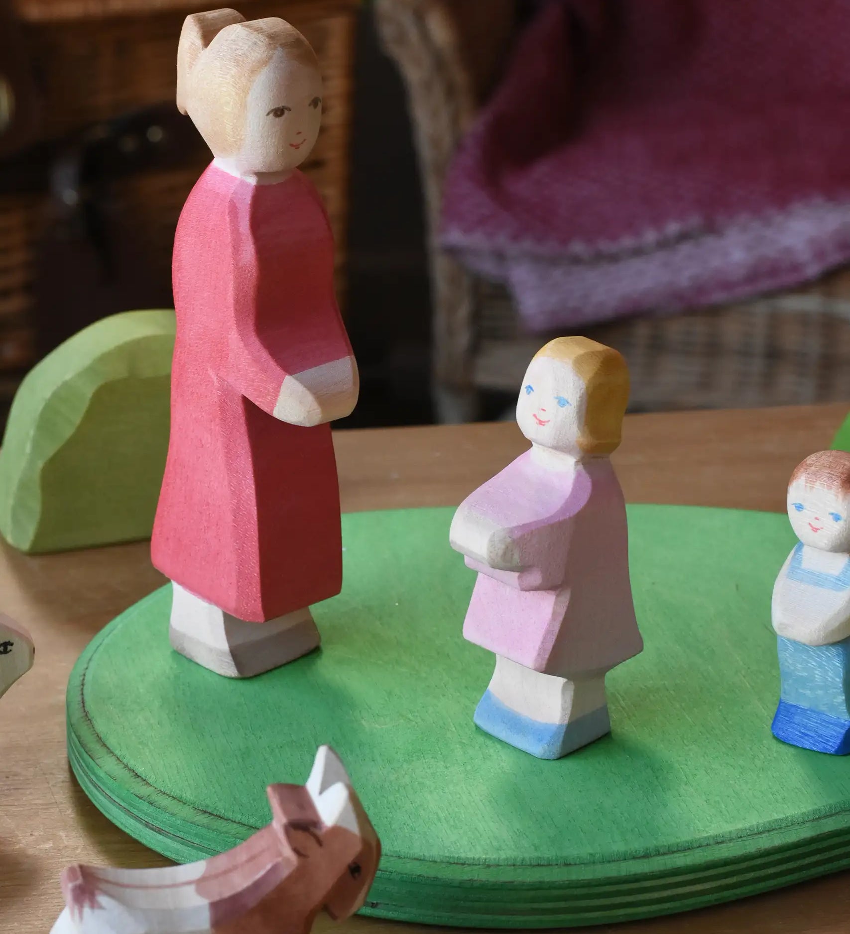 Ostheimer white skin mother and daughter figures placed on a green meadow grass plate. 