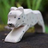 A close up of the Ostheimer snow leopard's face showing the hand painted details. This expertly hand crafted wooden figure is part of a large range of wooden toys here at Babipur.