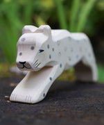 A close up of the Ostheimer snow leopard's face showing the hand painted details. This expertly hand crafted wooden figure is part of a large range of wooden toys here at Babipur.