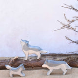 Three Ostheimer wolves wooden toy figures shown in a small world play set up. A full range of expertly crafted wooden toy figures and scenery are available here at Babipur.