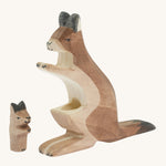 The Ostheimer wooden baby kangaroo figure next to the mother kangaroo figure showing the hole where the baby kangaroo sits 