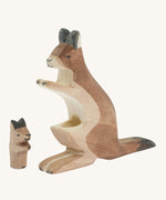 The Ostheimer wooden baby kangaroo figure next to the mother kangaroo figure showing the hole where the baby kangaroo sits 