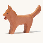 A brown wooden Ostheimer bremer standing dog  on a cream background.