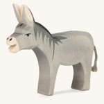 A wooden Ostheimer bremer standing donkey on a cream background. 