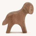 A brown wooden standing Ostheimer lamb figure on a cream background.