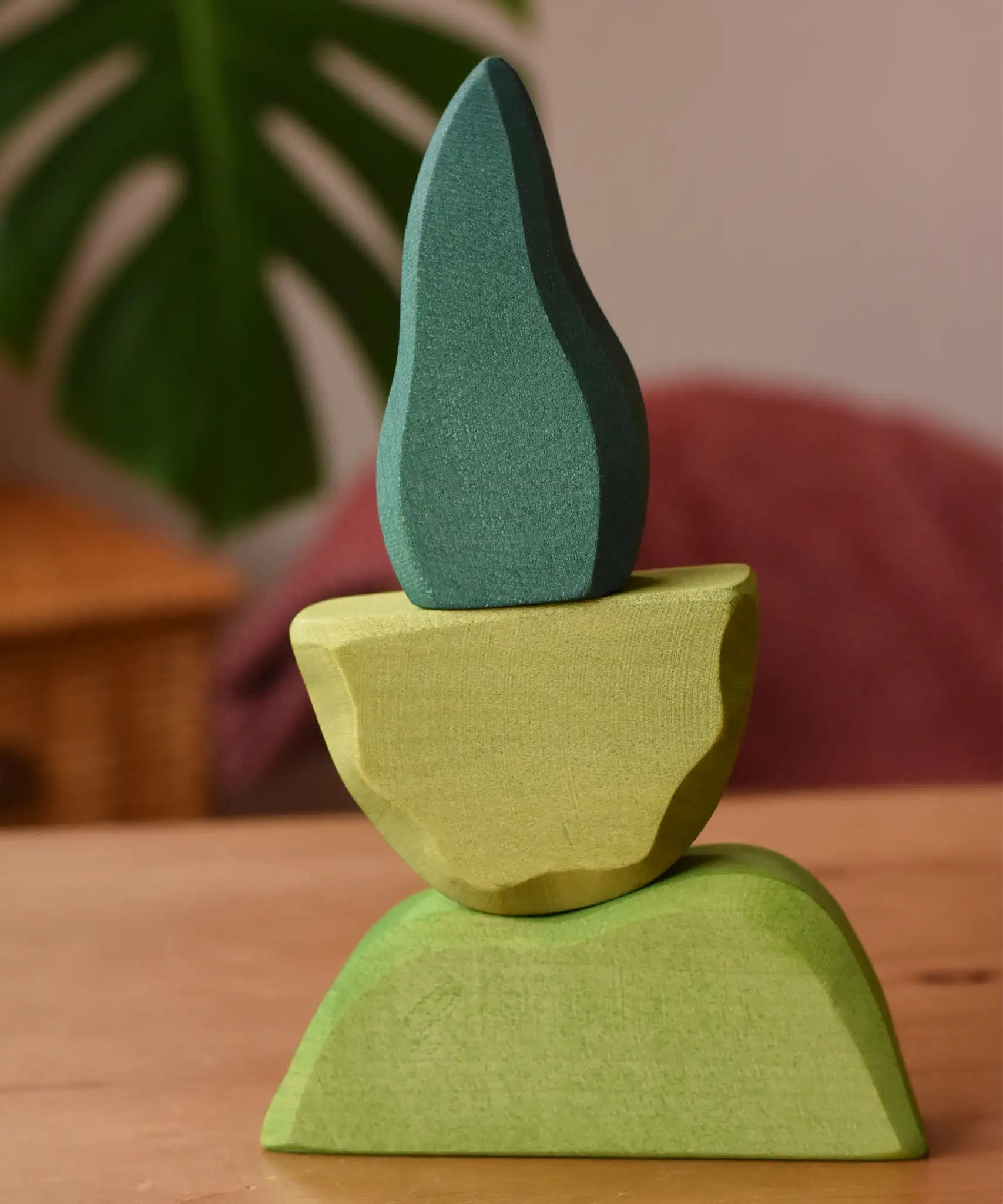 Ostheimer light, middle and dark green wooden bush scenery pieces stacked on top of each other.