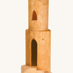 Ostheimer wooden castle tower toy on a cream background
