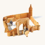 Ostheimer kids handmade wooden castle playset laid out on a cream background