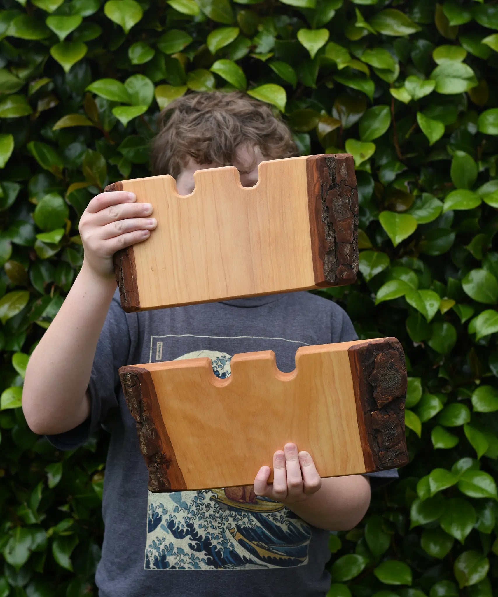 Two Ostheimer large wooden castle wall in a child's hands.