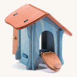 A wooden Ostheimer chicken hut on a cream background.