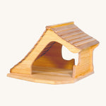 A wooden Ostheimer cottage on a cream background.