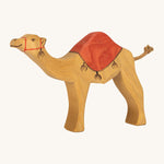 Ostheimer kids handmade wooden dromedary toy figure with red painted saddle on a cream background
