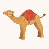 Ostheimer kids handmade wooden dromedary toy figure with red painted saddle on a cream background