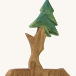 A wooden Ostheimer fir free for dwarves on a cream background.