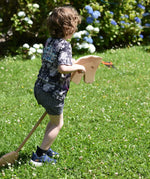 Child playing with the Ostheimer wooden hobby horse toy.